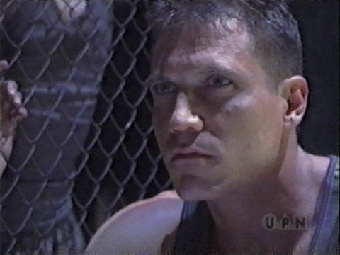 Image of Holt McCallany, as Owen Decker, sitting and looking pensive