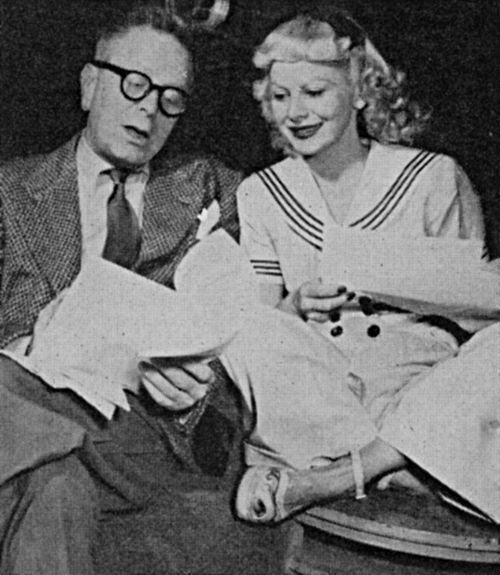 Black and white image of Goodman Ace and Ruth Gilbert at work on 'Ruthie on the Telephone'