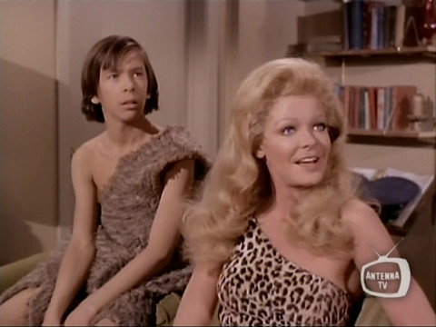 Image from an episode of It's About Time showing Pat Cardi (as Breer) and Mary Grace (as Mlor)