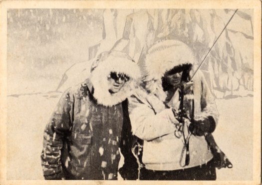 Scan of the front of a Voyage to the Bottom of the Sea trading card depicting Curley Jones and Seaman Bryant trapped on ice.