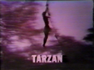 Still from the Tarzan fall preview featuring Ron Ely swinging on a vine.