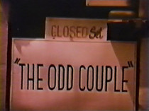 Still shot of a door with an 'The Odd Couple' sign on it, from the set of the sitcom in 1970.