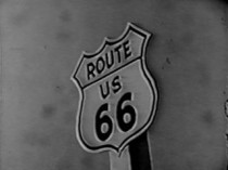 Black and white still featuring the Route 66 logo.