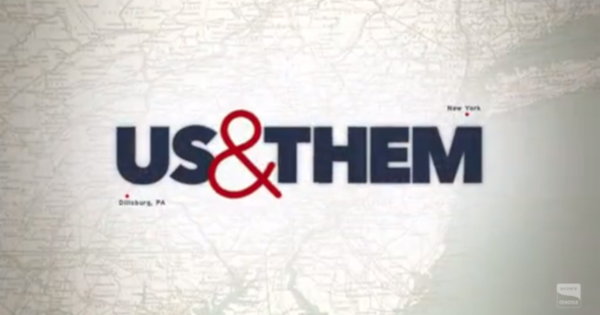 The Us & Them title card.