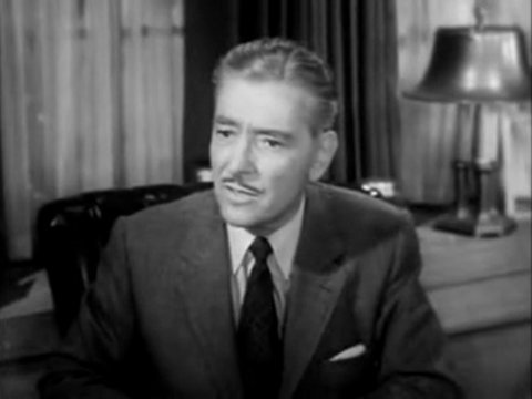 Black and white still from an episode of The Halls of Ivy showing Ronald Colman as Dr. William Todhunter Hall
