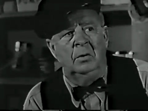 Black and white still from the premiere episode of It's a Man's World showing Harry Harvey, Sr. as Mr. Stott.