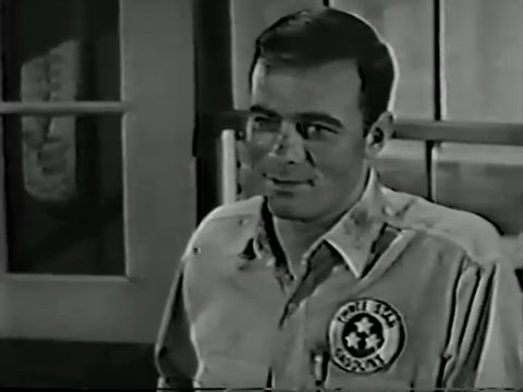 Black and white still from an episode of It's a Man's World showing Glenn Corbett as Wes Macauley.