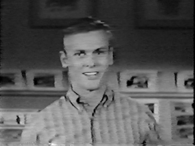 Black and white image of actor Tab Hunter from The Tab Hunter Show.
