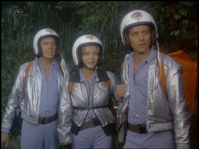 Still from the Salvage-1 episode Dark Island showing Harry, Mel, and Skip in their flight suits on Bantu Lorova.