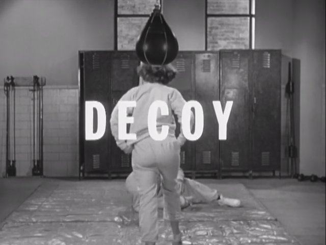 Still from the Decoy episode Deadly Corridor showing the title graphic.