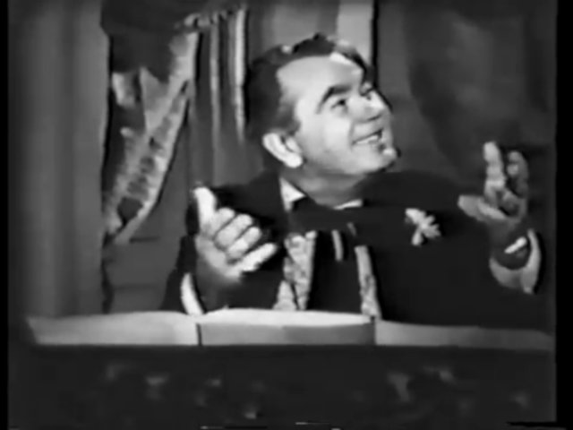 Still from the Joe and Mabel episode Mabel's Voice showing Oscar Homolka as Ralph Caruso.