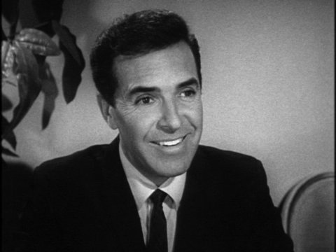 Black-and-white still from an episode of Karen featuring Miguel Landa.