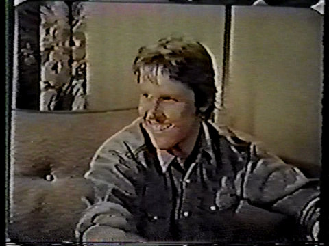 Color still from an episode of The Texas Wheelers showing Gary Busey as Truckie Wheeler.